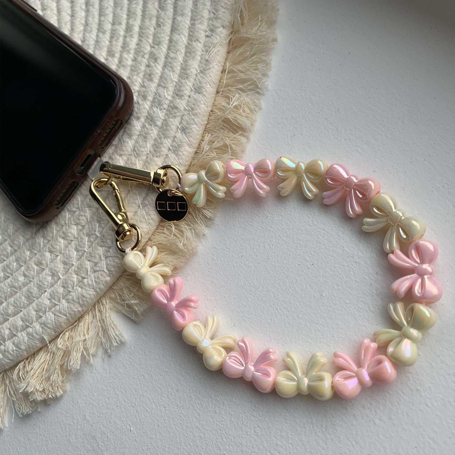 Cordon de téléphone Bow - rose clair blanc - or