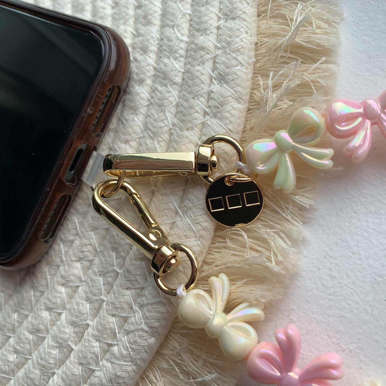 Cordon de téléphone Bow - rose clair blanc - or
