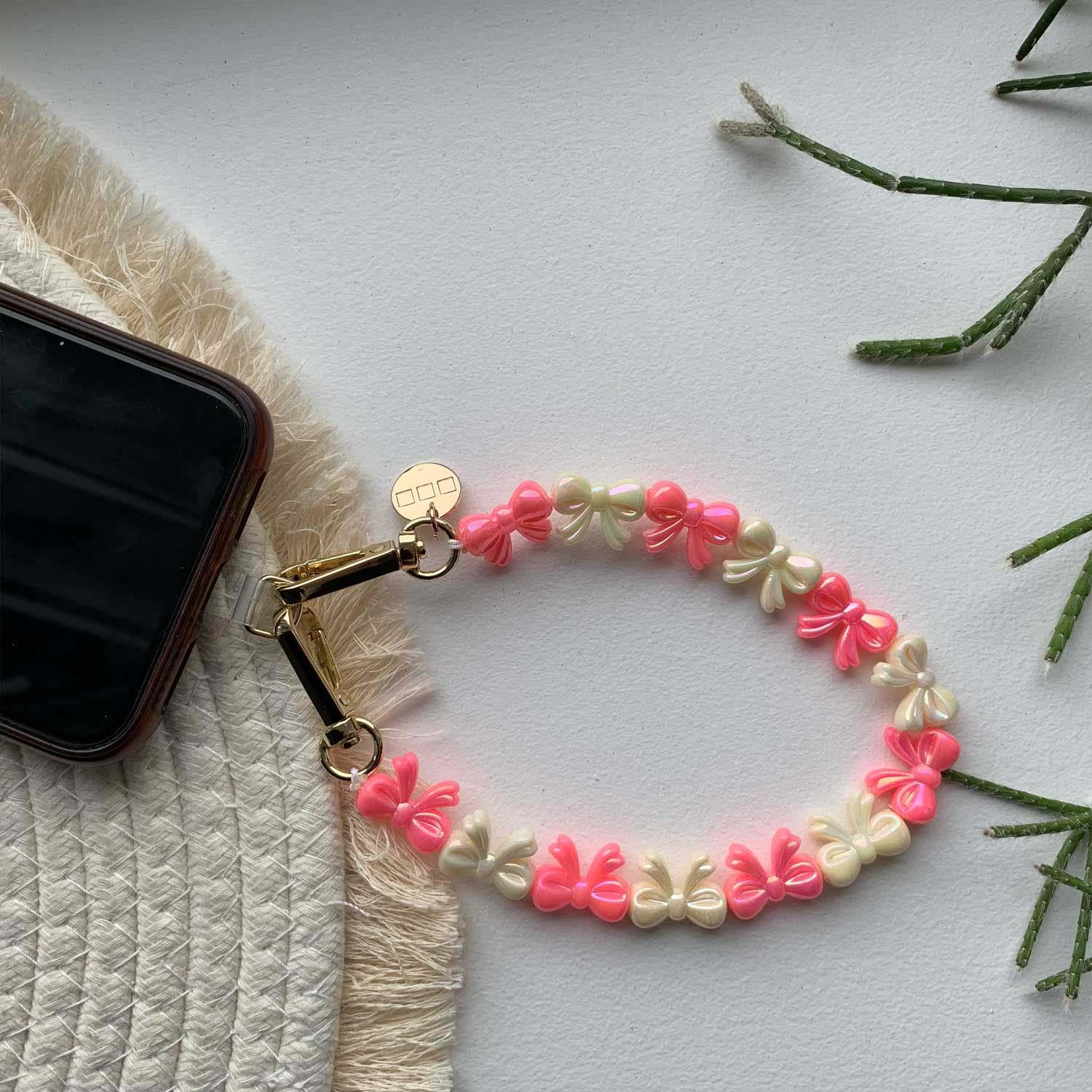 Cordon de téléphone Bow - rose blanc - or