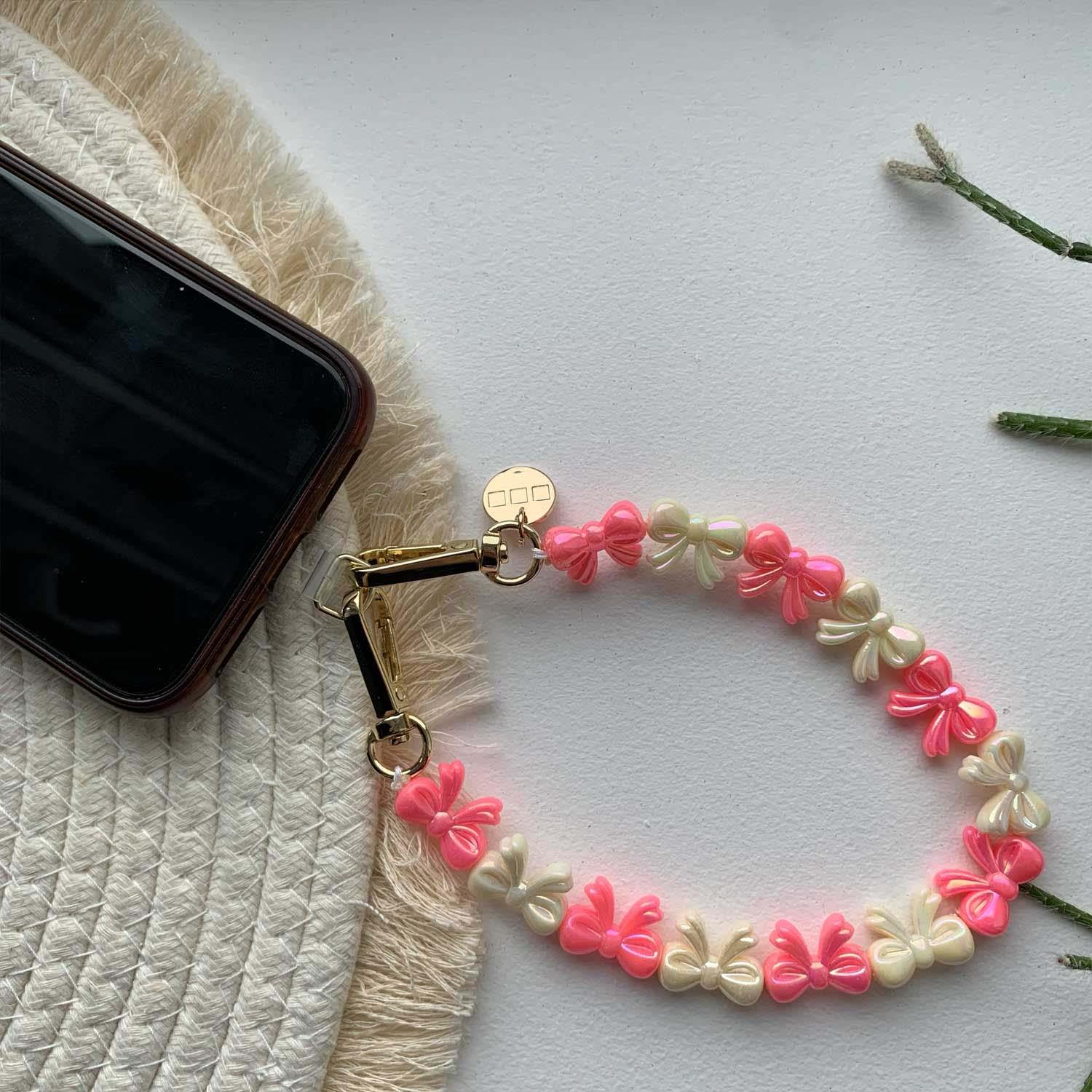 Cordon de téléphone Bow - rose blanc - or