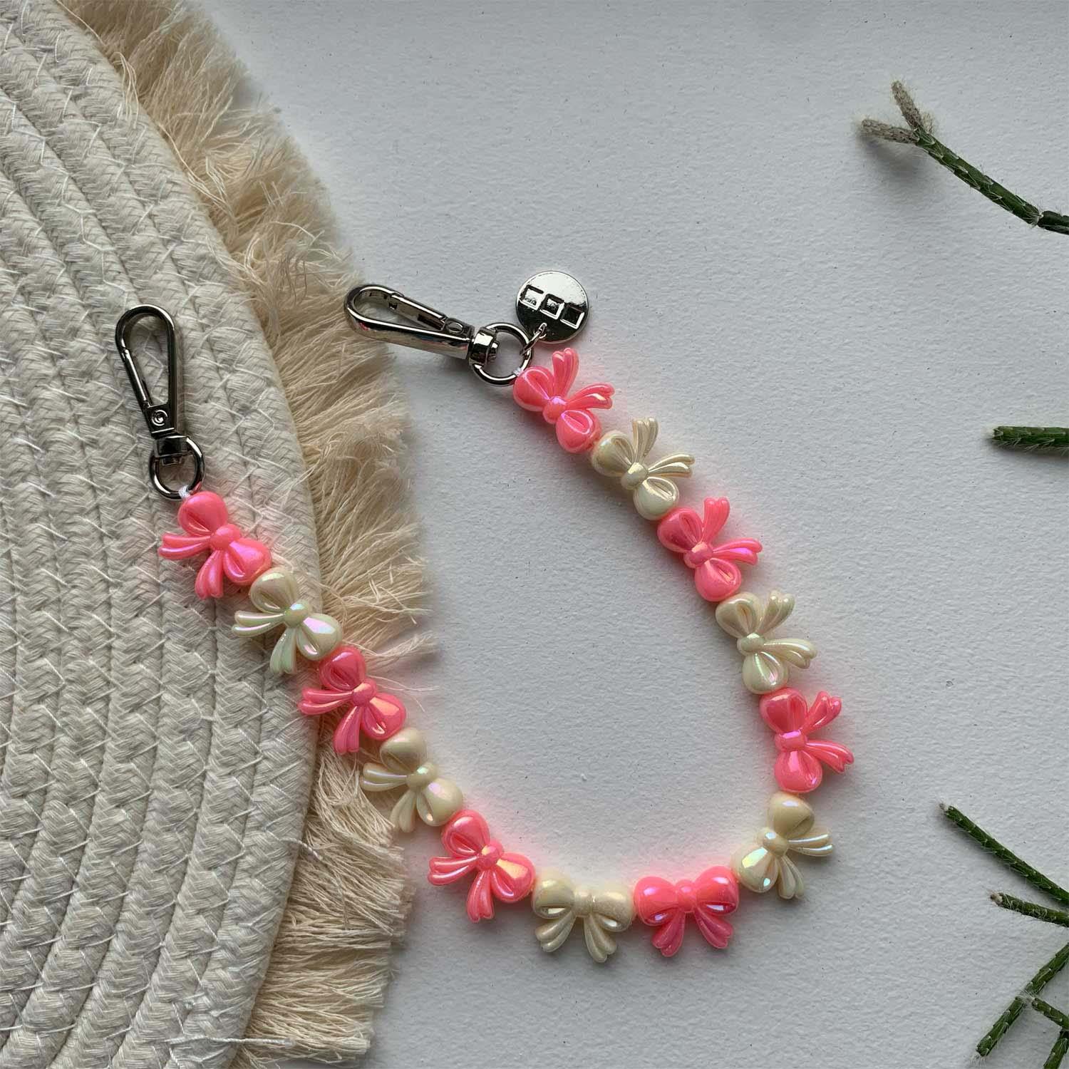 Cordon pour téléphone Bow – rose blanc – argent